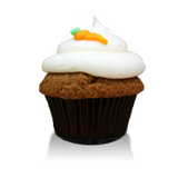 Delicious carrot cake with cream cheese icing topped with a cute frosted carrot