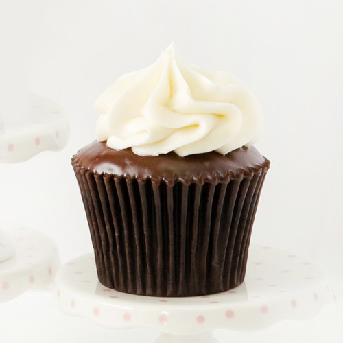 Chocolate cake with a creamy marshmallow filling dipped in chocolate ganache with more filling on top