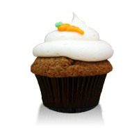Delicious carrot cake with cream cheese icing topped with a cute frosted carrot